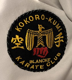 An original Kokoro Kumi club badge